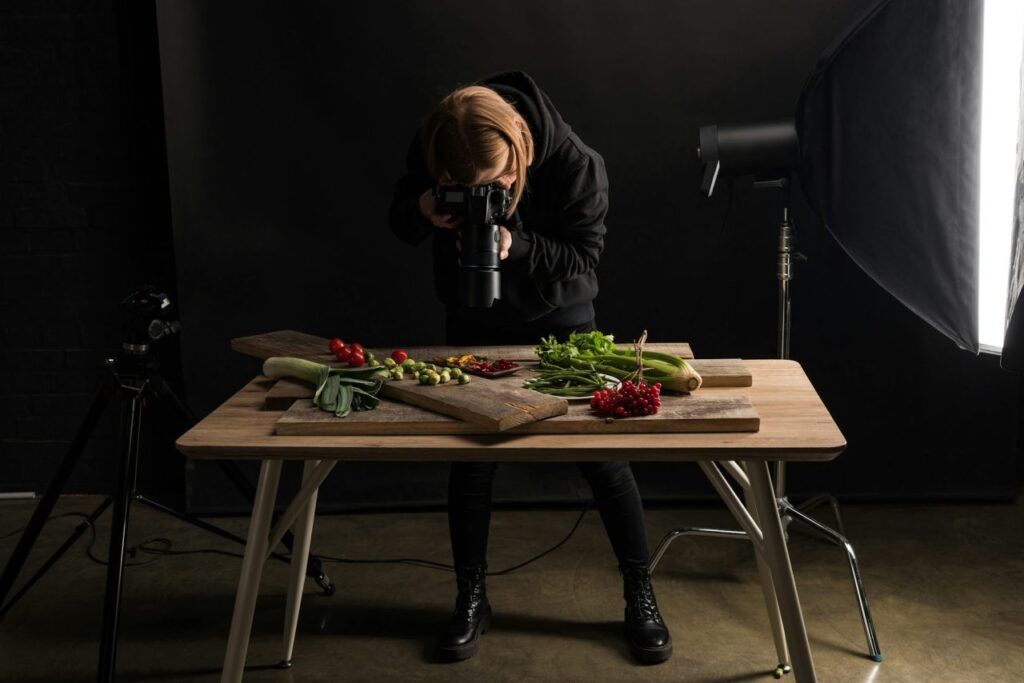 female-photographer-making-food-composition-for-commercial-photography-and-taking-photo-on-digital.jpg